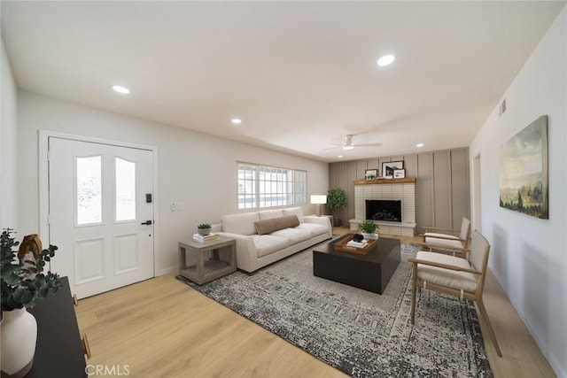 25810 San Felipe Dr, Hemet, CA 92544 - living room with wood finished floors, ceiling fan, a brick fireplace, recessed lighting, and baseboards