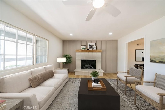 25810 San Felipe Dr, Hemet, CA 92544 - living area featuring light wood-style flooring, recessed lighting, a ceiling fan, and a fireplace