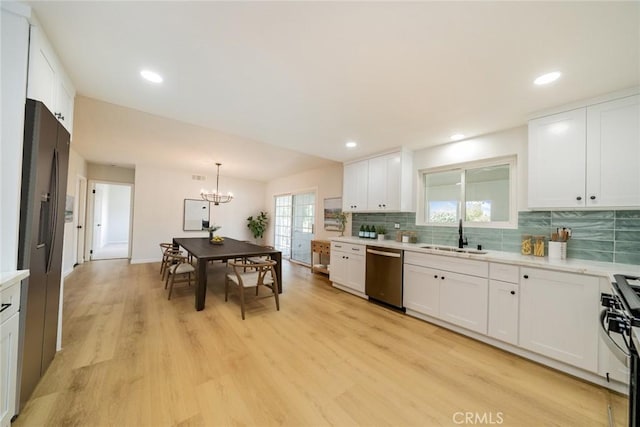 25810 San Felipe Dr, Hemet, CA 92544 - kitchen with appliances with stainless steel finishes, a sink, light countertops, a chandelier, and recessed lighting