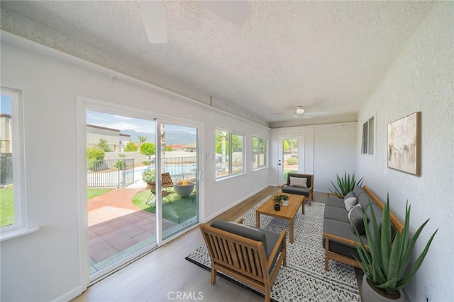25810 San Felipe Dr, Hemet, CA 92544 - sunroom with a ceiling fan, a textured ceiling, outdoor lounge area, and wood finished floors