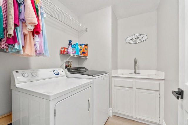 8550 Alexandria St, Riverside, CA 92508 - laundry area with washing machine and clothes dryer and light wood-style floors