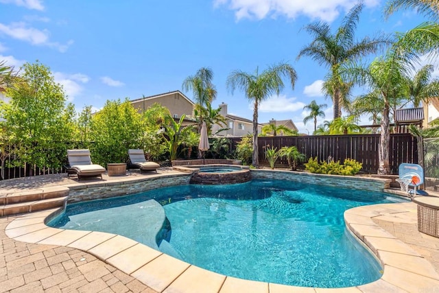8550 Alexandria St, Riverside, CA 92508 - view of swimming pool featuring a pool with connected hot tub, a fenced backyard, and a patio