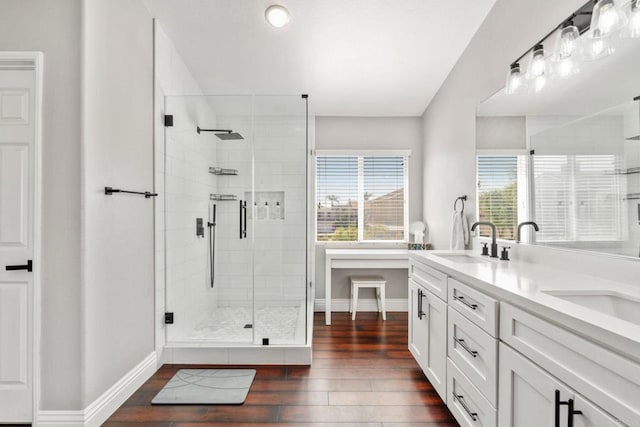 8550 Alexandria St, Riverside, CA 92508 - full bathroom with wood finished floors, a stall shower, baseboards, and double vanity