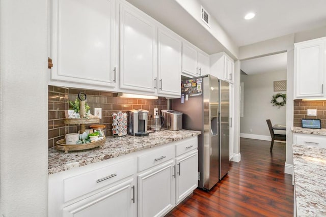 8550 Alexandria St, Riverside, CA 92508 - kitchen with stainless steel fridge with ice dispenser, baseboards, dark wood finished floors, decorative backsplash, and white cabinetry