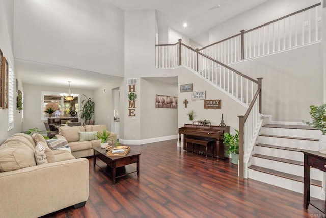 8550 Alexandria St, Riverside, CA 92508 - living room featuring stairway, wood finished floors, a chandelier, a high ceiling, and baseboards