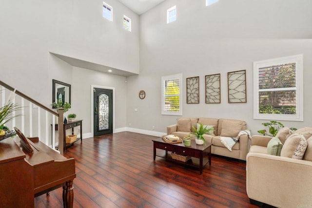 8550 Alexandria St, Riverside, CA 92508 - living area with a high ceiling, healthy amount of natural light, stairway, and dark wood-style floors