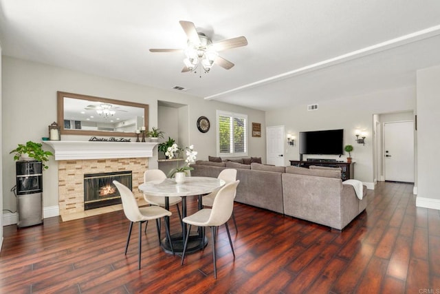 8550 Alexandria St, Riverside, CA 92508 - dining area with dark wood finished floors, ceiling fan, and a fireplace