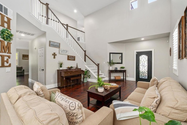 8550 Alexandria St, Riverside, CA 92508 - living room featuring a towering ceiling, wood finished floors, plenty of natural light, stairway, and baseboards