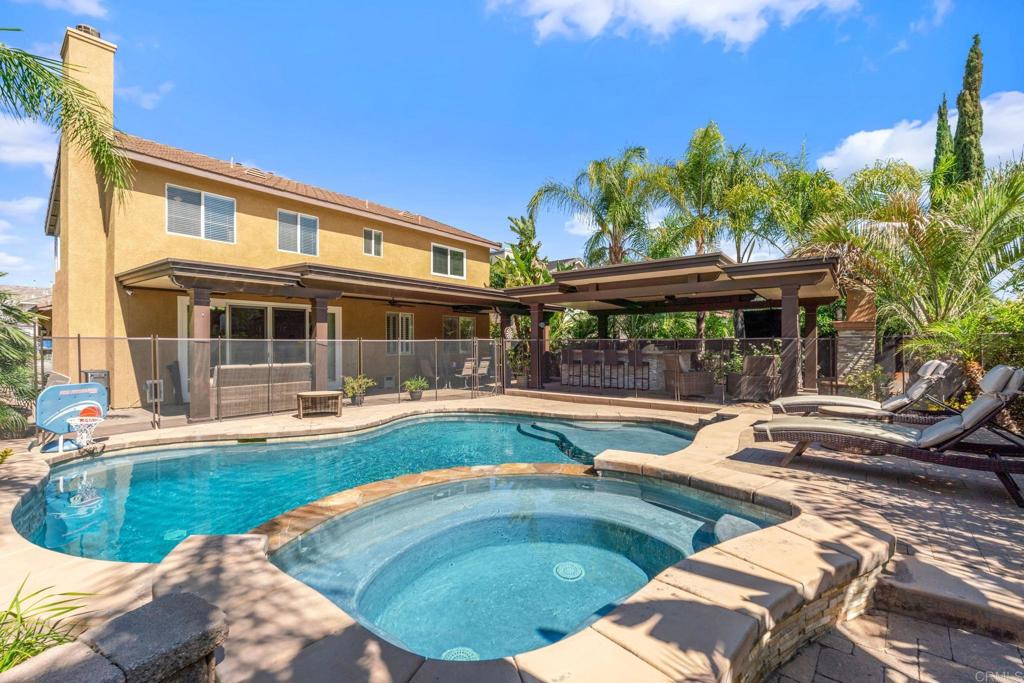 8550 Alexandria St, Riverside, CA 92508 - view of swimming pool featuring a patio, a pool with connected hot tub, and a ceiling fan