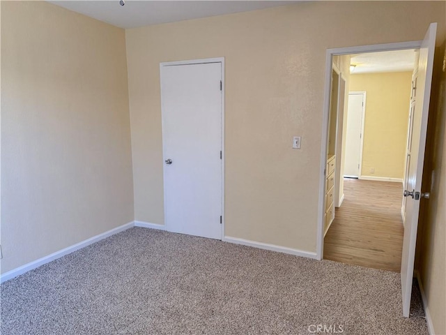 812 Wilson Ave, Bakersfield, CA 93308 - spare room with carpet flooring and baseboards