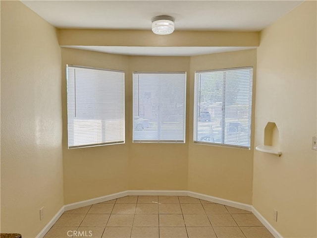 812 Wilson Ave, Bakersfield, CA 93308 - empty room featuring light tile patterned floors and baseboards