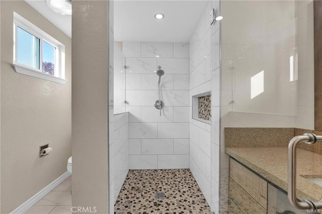 19055 Seaforth St, Hesperia, CA 92345 - bathroom with tiled shower, toilet, recessed lighting, and baseboards