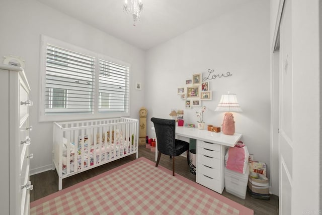 3001 Bravo Loop Unit 1, Chula Vista, CA 91915 - bedroom featuring wood finished floors, a nursery area, and baseboards