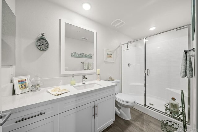 3001 Bravo Loop Unit 1, Chula Vista, CA 91915 - bathroom with toilet, vanity, a shower stall, and wood finished floors