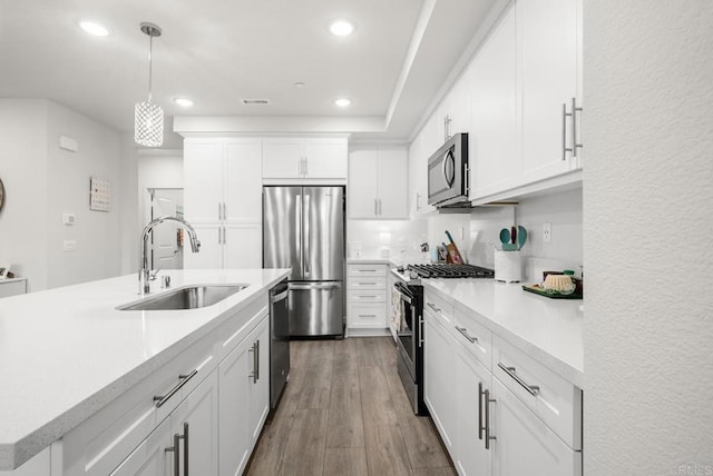 3001 Bravo Loop Unit 1, Chula Vista, CA 91915 - kitchen with appliances with stainless steel finishes, a sink, recessed lighting, light countertops, and pendant lighting