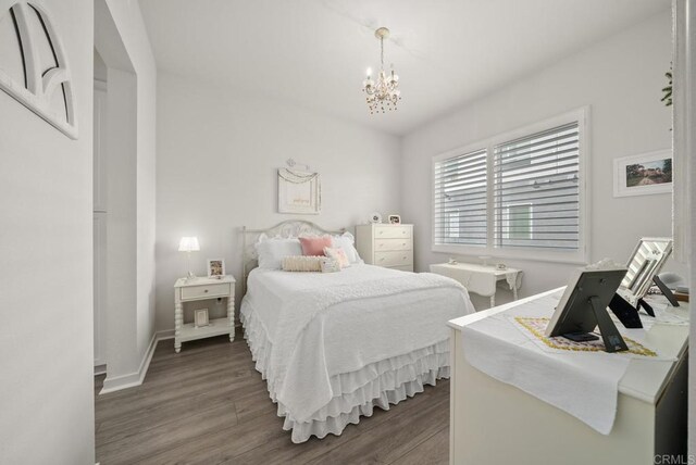 3001 Bravo Loop Unit 1, Chula Vista, CA 91915 - bedroom featuring wood finished floors and a chandelier