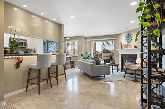 2623 Antonio Dr Unit 104, Camarillo, CA 93010 - living area featuring recessed lighting, a fireplace, baseboards, and a ceiling fan