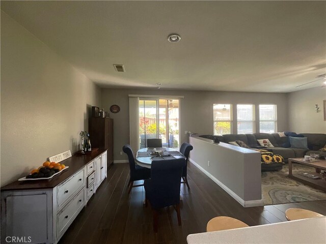 31728 Pompei Ln, Winchester, CA 92596 - dining area featuring dark wood-type flooring and baseboards