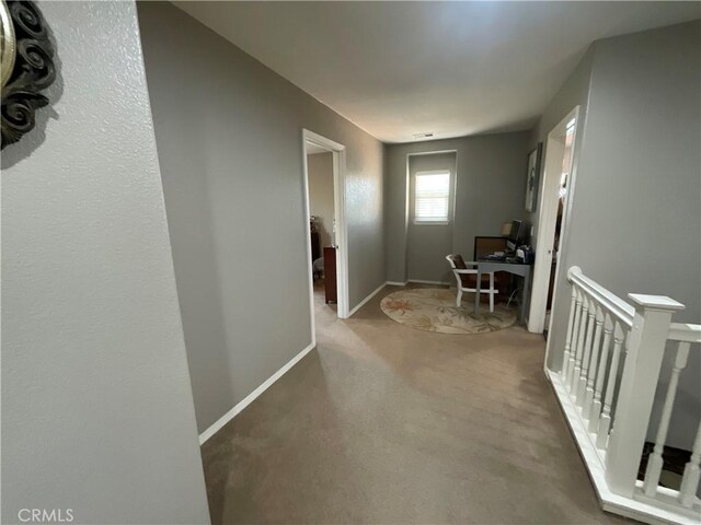 31728 Pompei Ln, Winchester, CA 92596 - hall with an office area, baseboards, carpet flooring, and an upstairs landing
