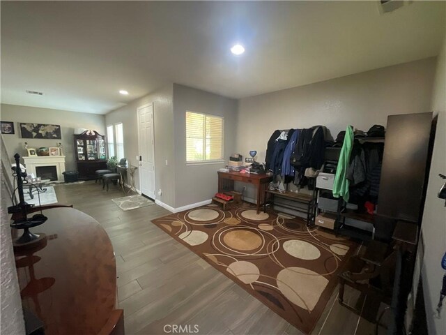 31728 Pompei Ln, Winchester, CA 92596 - interior space featuring wood finished floors, baseboards, a fireplace, and recessed lighting