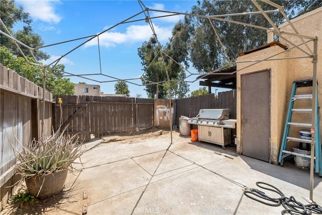 12241 Carnation Unit B, Moreno Valley, CA 92557 - fenced backyard featuring a patio area and area for grilling