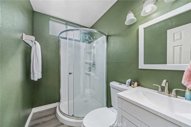 12241 Carnation Unit B, Moreno Valley, CA 92557 - full bath featuring a stall shower, toilet, vanity, wood finished floors, and a textured wall