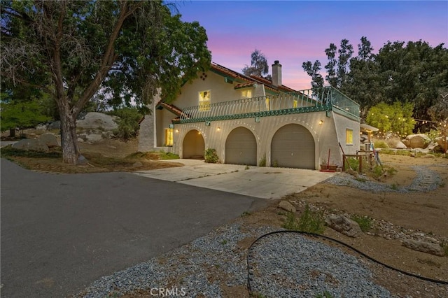 40901 Gibbel Rd, Hemet, CA 92544 - mediterranean / spanish-style home with a balcony, a garage, and driveway