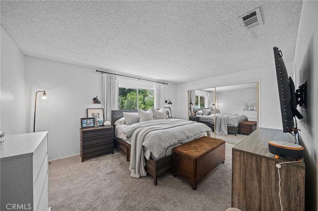 40901 Gibbel Rd, Hemet, CA 92544 - bedroom with light colored carpet, a textured ceiling, and a closet