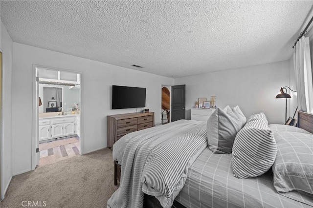 40901 Gibbel Rd, Hemet, CA 92544 - bedroom featuring a textured ceiling, light carpet, and ensuite bathroom