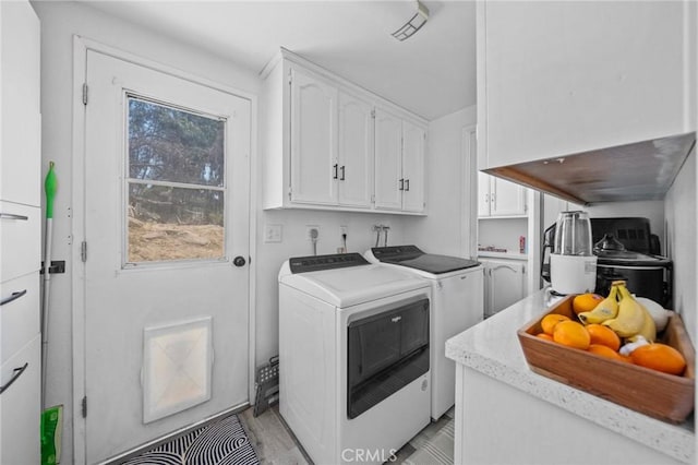 40901 Gibbel Rd, Hemet, CA 92544 - laundry area featuring cabinet space, washer and dryer, and light wood-style flooring