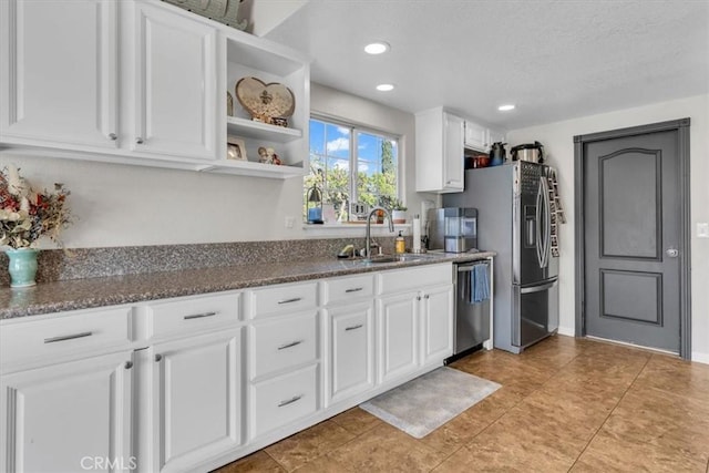 17660 Seaforth St, Hesperia, CA 92345 - kitchen featuring stainless steel appliances, white cabinetry, dark stone counters, open shelves, and recessed lighting