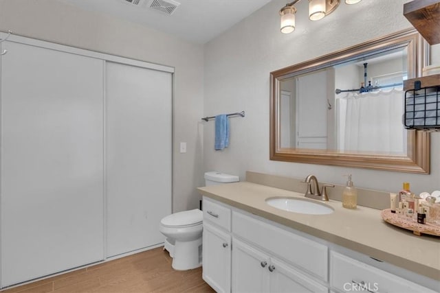 17660 Seaforth St, Hesperia, CA 92345 - full bathroom featuring vanity, wood finished floors, and a shower with curtain