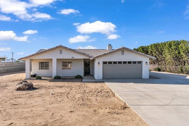 17660 Seaforth St, Hesperia, CA 92345 - single story home with an attached garage, a tiled roof, concrete driveway, stucco siding, and a chimney