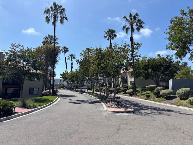 3513 Caminito Sierra Unit 101, Carlsbad, CA 92009 - view of asphalt road with curbs and a residential view