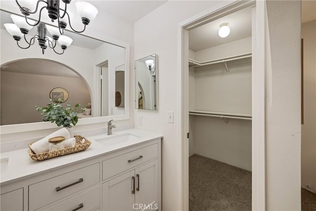20310 Anza Ave Unit O, Torrance, CA 90503 - bathroom with double vanity, a chandelier, and a walk in closet