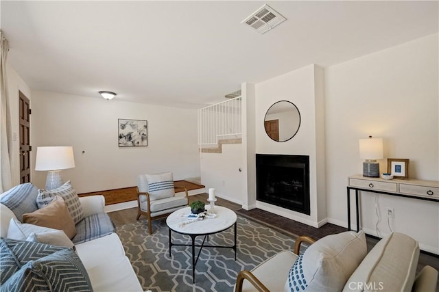20310 Anza Ave Unit O, Torrance, CA 90503 - living area with dark wood-type flooring, baseboards, and a fireplace