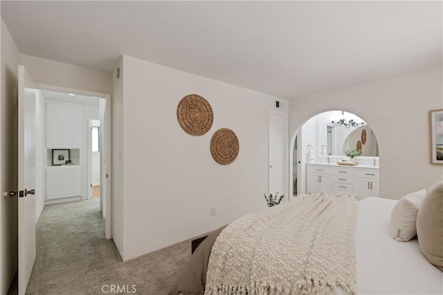 20310 Anza Ave Unit O, Torrance, CA 90503 - carpeted bedroom featuring arched walkways and connected bathroom