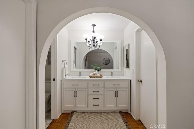 20310 Anza Ave Unit O, Torrance, CA 90503 - full bathroom with a chandelier, double vanity, and toilet