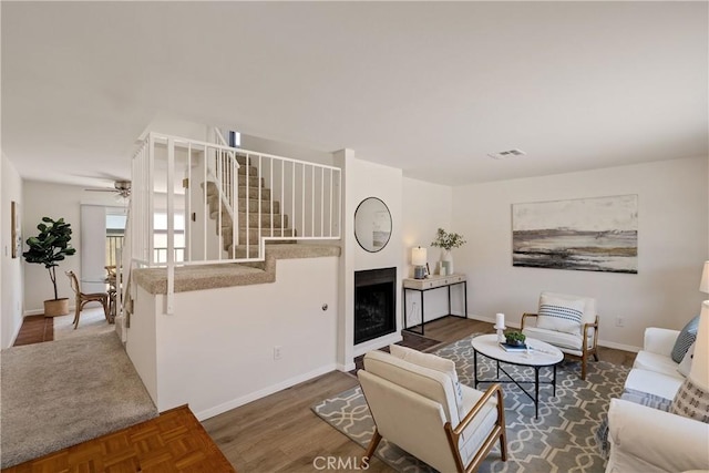20310 Anza Ave Unit O, Torrance, CA 90503 - living area with stairway, baseboards, ceiling fan, wood finished floors, and a fireplace