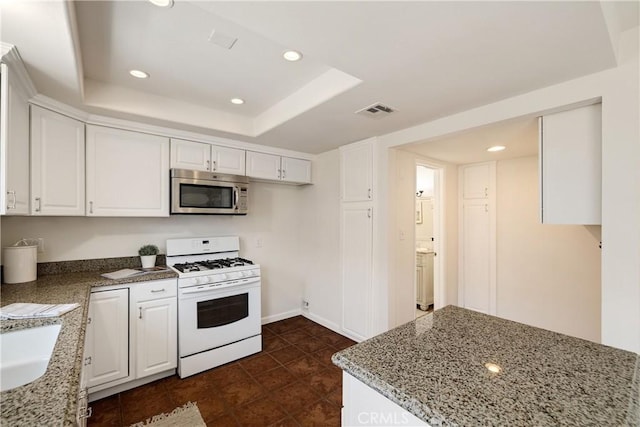 20310 Anza Ave Unit O, Torrance, CA 90503 - kitchen with stainless steel microwave, white range with gas cooktop, white cabinets, light stone counters, and recessed lighting