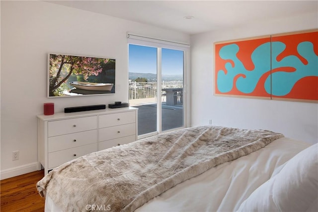 3721 Glenridge Dr, Sherman Oaks, CA 91423 - bedroom with access to exterior, wood finished floors, and baseboards
