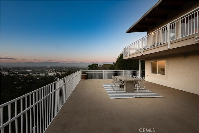 3721 Glenridge Dr, Sherman Oaks, CA 91423 - patio terrace at dusk with outdoor dining area, a patio area, and a balcony