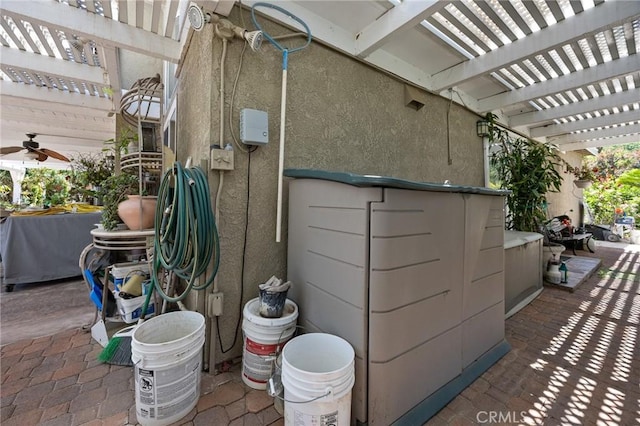10750 Orchard View Ln, Riverside, CA 92503 - view of side of home featuring a pergola and stucco siding
