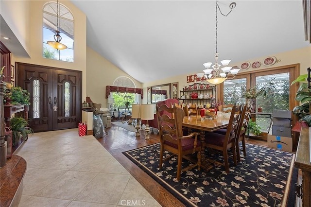 10750 Orchard View Ln, Riverside, CA 92503 - dining room featuring a chandelier, high vaulted ceiling, healthy amount of natural light, and tile patterned flooring