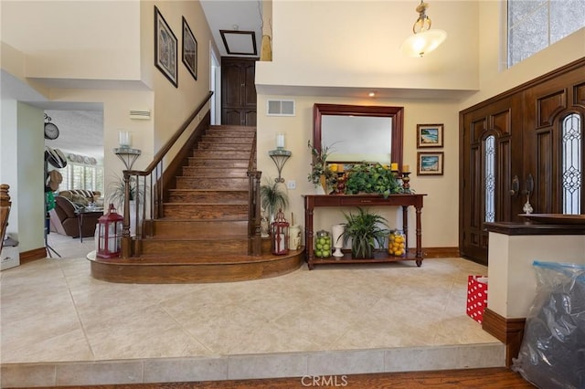 10750 Orchard View Ln, Riverside, CA 92503 - tiled entrance foyer featuring stairway, a high ceiling, and baseboards