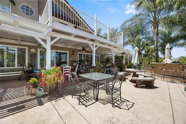 10750 Orchard View Ln, Riverside, CA 92503 - view of patio / terrace with a balcony, outdoor dining space, and a ceiling fan