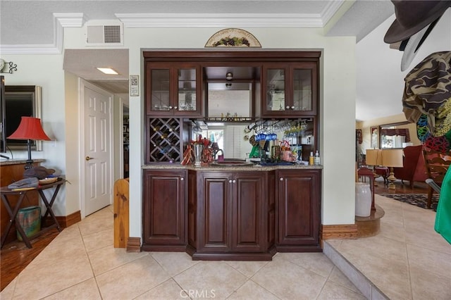 10750 Orchard View Ln, Riverside, CA 92503 - indoor wet bar featuring light tile patterned flooring, crown molding, and baseboards