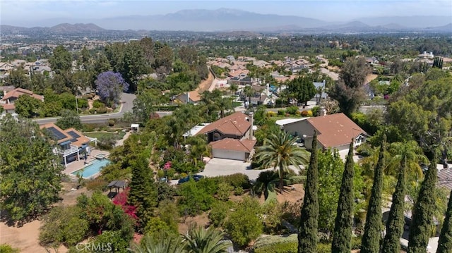 10750 Orchard View Ln, Riverside, CA 92503 - aerial overview of property's location with mountains, a pool area, and nearby suburban area