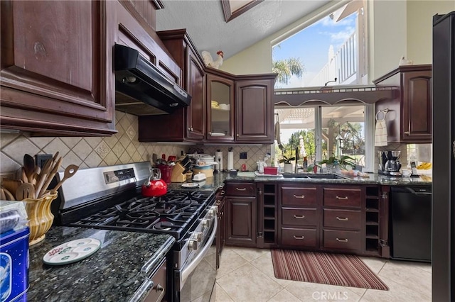 10750 Orchard View Ln, Riverside, CA 92503 - kitchen with stainless steel range with gas stovetop, lofted ceiling, light tile patterned floors, dark stone counters, and backsplash