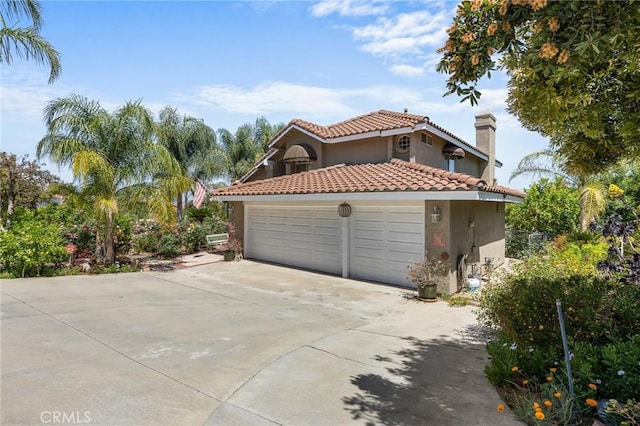 10750 Orchard View Ln, Riverside, CA 92503 - view of side of property featuring an attached garage, stucco siding, concrete driveway, a tiled roof, and a chimney